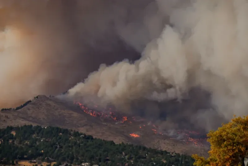 Wildfire smoke and flames over the hills near Medford, Oregon during Rogue Valley fire season